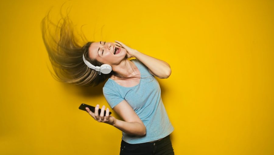 woman wearing white headphones